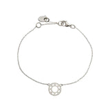 Lightweight silver bracelet with intricate mandala-inspired charm and modern jewelry styling.