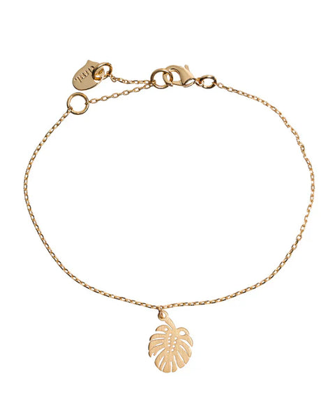 Women’s delicate gold monstera leaf bracelet with minimalist chain and tropical-inspired design.