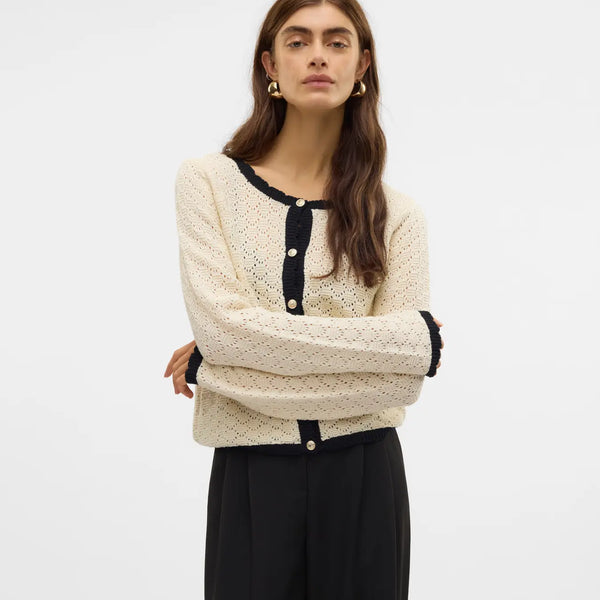 Women's ivory pointelle knit cardigan with black contrast trim, pearl-effect buttons and cropped silhouette for elegant everyday and office style.