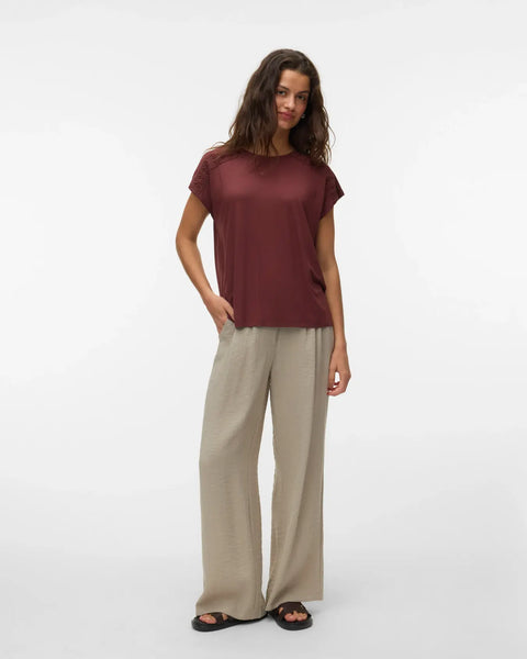 Women's boutique burgundy T-shirt with lace shoulder inserts, soft drape, and flattering casual fit for all seasons.