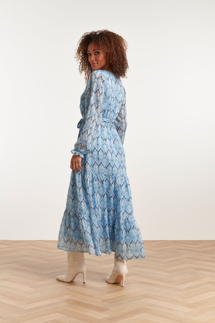 Romantic women’s blue flowy dress with gathered waist, soft drape fabric, and elegant bohemian-inspired silhouette.