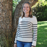 Parisian-style striped sweater with crew neck and long sleeves for classic casual and travel-ready fashion looks.