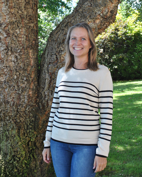 Parisian-style striped sweater with crew neck and long sleeves for classic casual and travel-ready fashion looks.