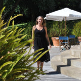 Relaxed fit black summer dress featuring soft textured fabric and breezy sleeveless silhouette for resort wear fashion.