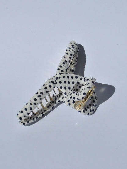 Stylish white with black polka dot claw clip designed for secure all-day hold and comfortable updo hairstyles for women.