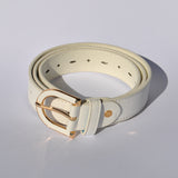 Women's adjustable faux leather belt with vibrant blue finish and polished gold hardware.