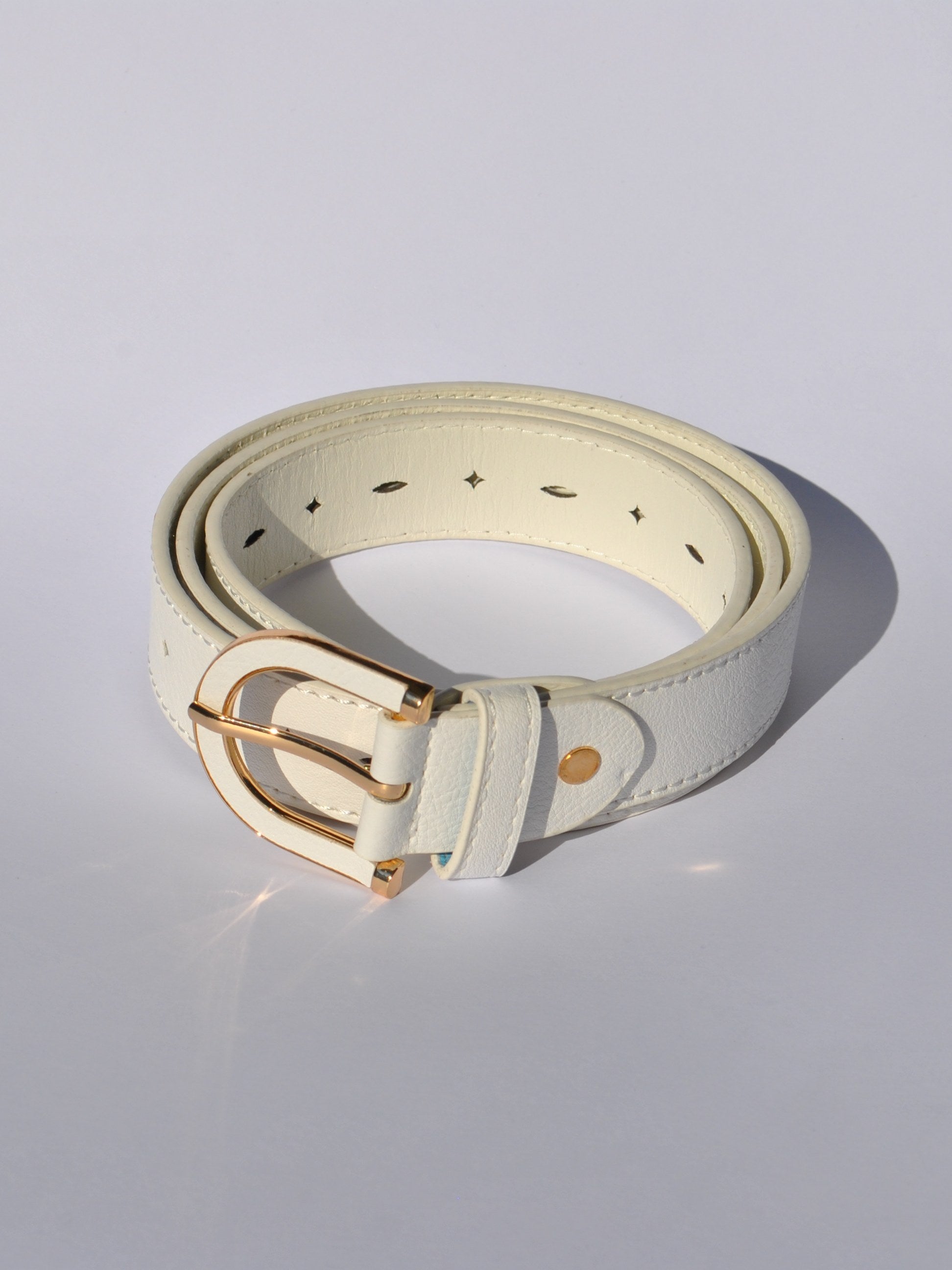 Women's adjustable faux leather belt with vibrant blue finish and polished gold hardware.