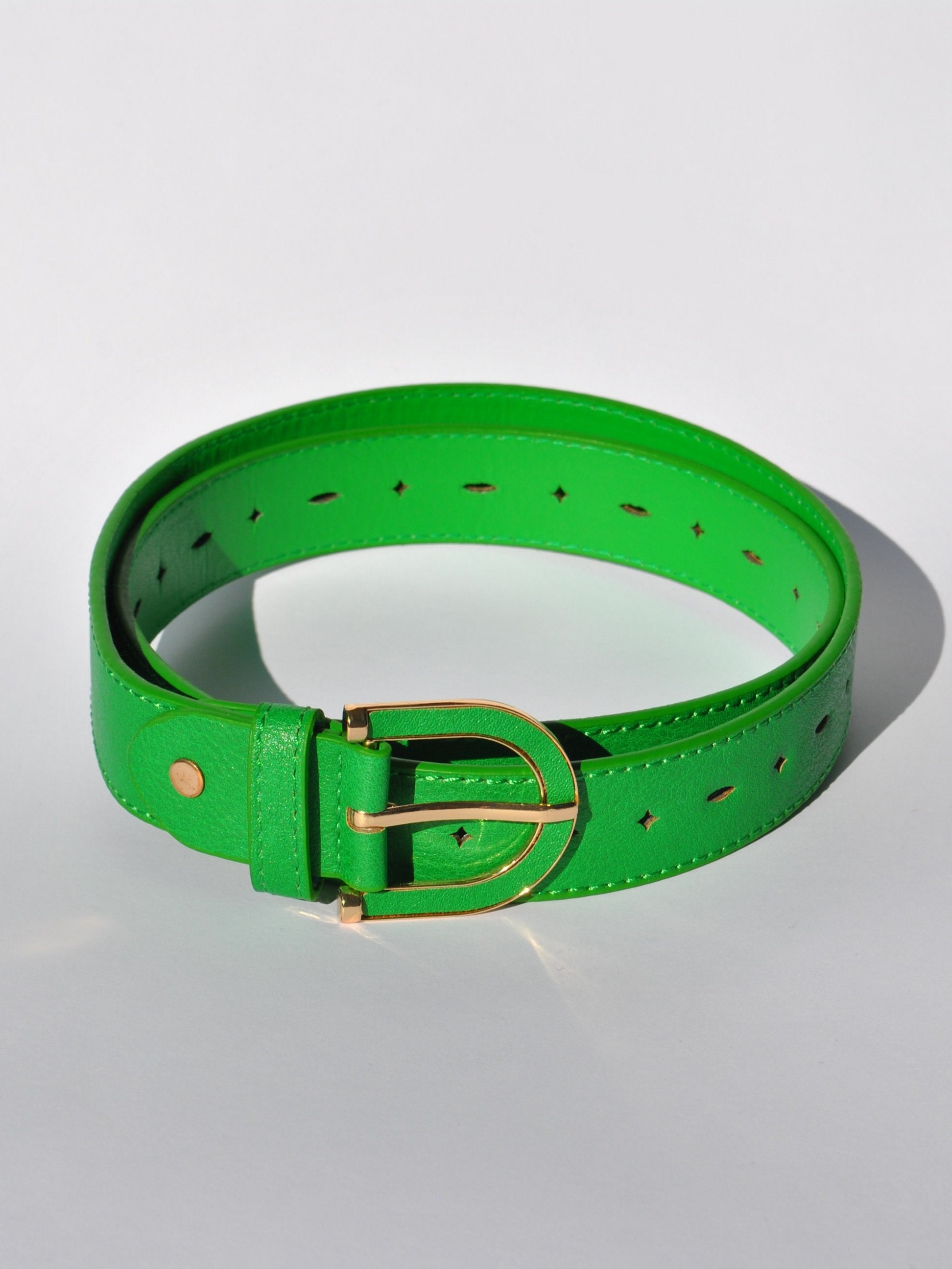 Women's colorful statement belt ideal for cinching dresses and high-waisted pants.