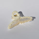 Women's premium claw clip accessory with oversized silhouette and secure hold.