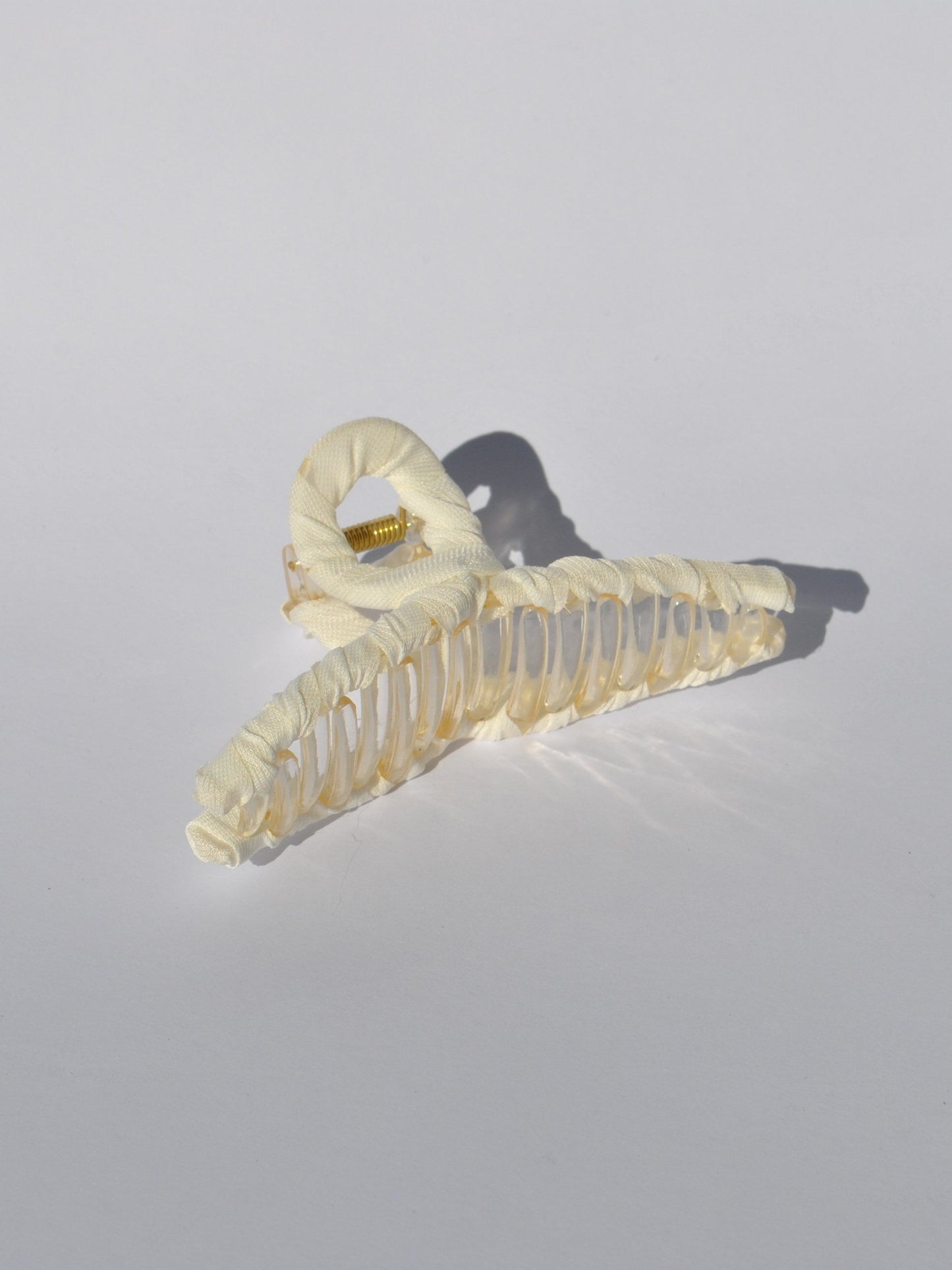 Women's premium claw clip accessory with oversized silhouette and secure hold.