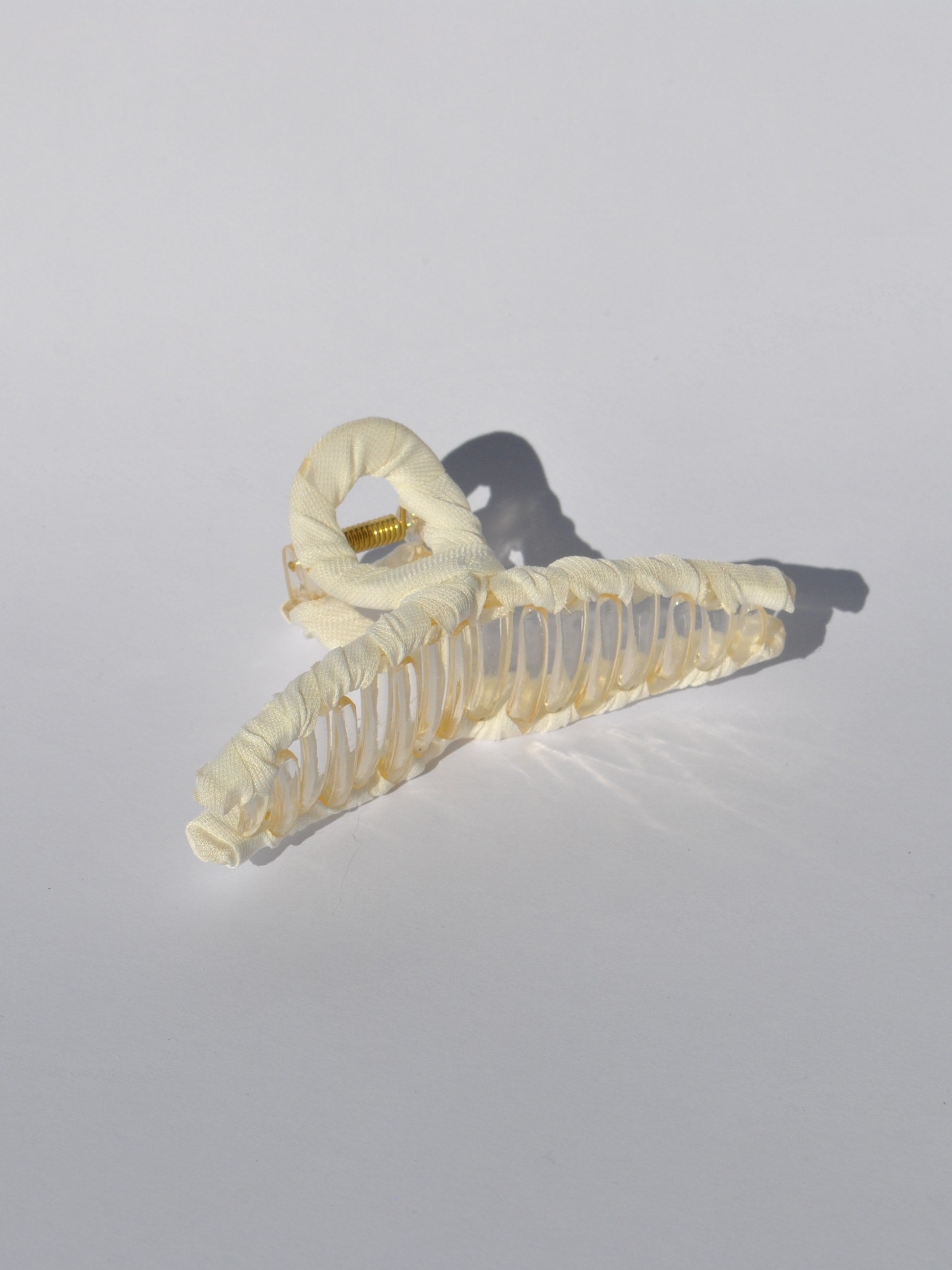 Women's premium claw clip accessory with oversized silhouette and secure hold.