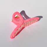 Premium oversized hair clip with soft textile finish and secure all-day hold.