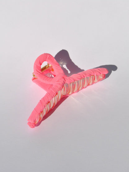 Premium oversized hair clip with soft textile finish and secure all-day hold.