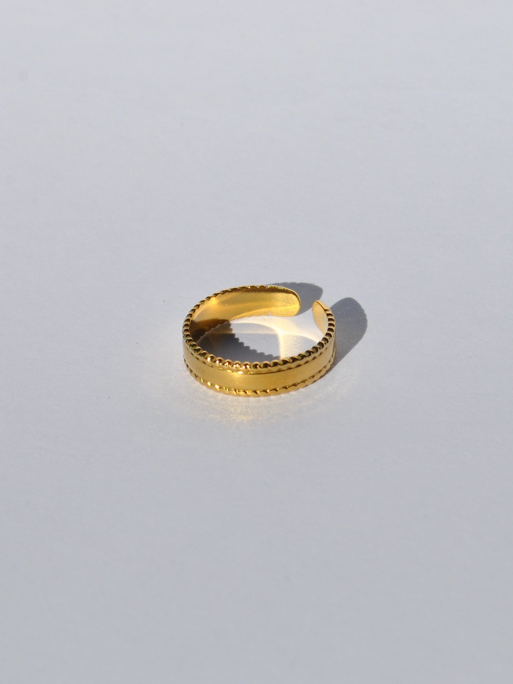 Minimal gold adjustable ring for women featuring modern sculptural design and timeless everyday elegance.