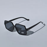 Women’s bold black sunglasses with oversized square frames and contemporary designer-inspired look for summer fashion.