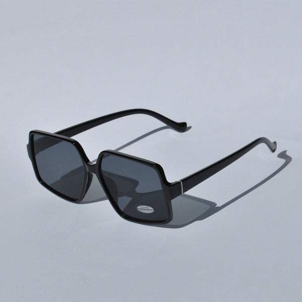 Women’s bold black sunglasses with oversized square frames and contemporary designer-inspired look for summer fashion.