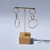 Gold fashion earrings featuring oversized open hoops and trendy modern statement jewelry aesthetic.