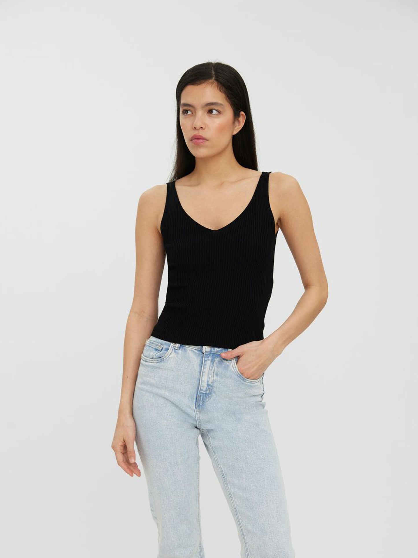 Women's fitted black knit tank with a modern minimalist design and soft stretch fabric.