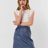 White minimalist top featuring broderie anglaise trim and timeless appeal.