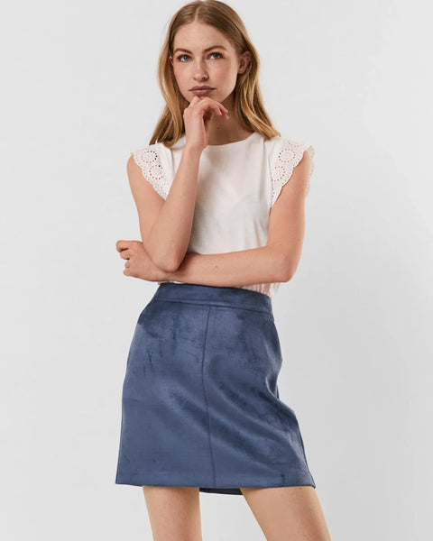 White minimalist top featuring broderie anglaise trim and timeless appeal.