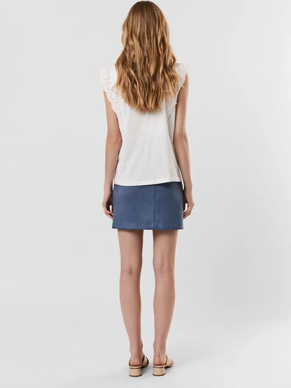 Women's embroidered sleeveless blouse with delicate eyelet flutter sleeve detail.