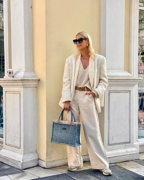 Trendy boutique tote bag with structured top handles, tactile woven texture, and modern coastal elegance.