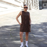 Women’s leopard print shift dress with sleeveless silhouette and trendy quiet luxury street style.