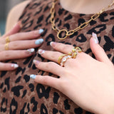 Close up of fabric of modern women’s animal print mini dress with relaxed silhouette and edgy off-duty model vibe