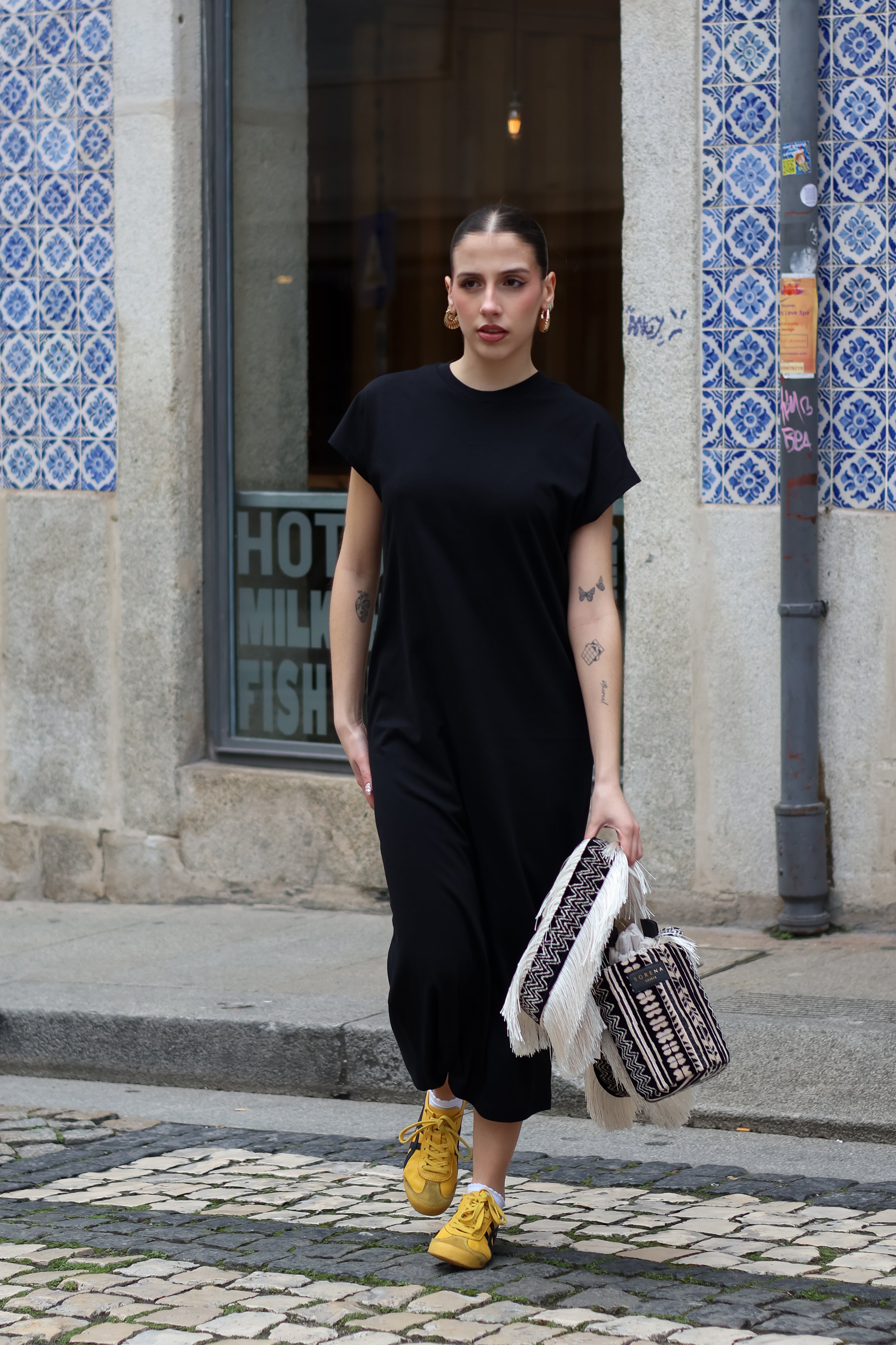Chic oversized black midi dress featuring soft draped fabric and elevated casual everyday wear aesthetic.