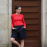Chic long sleeve red cropped sweater featuring soft ribbed texture and modern elevated casual wear.