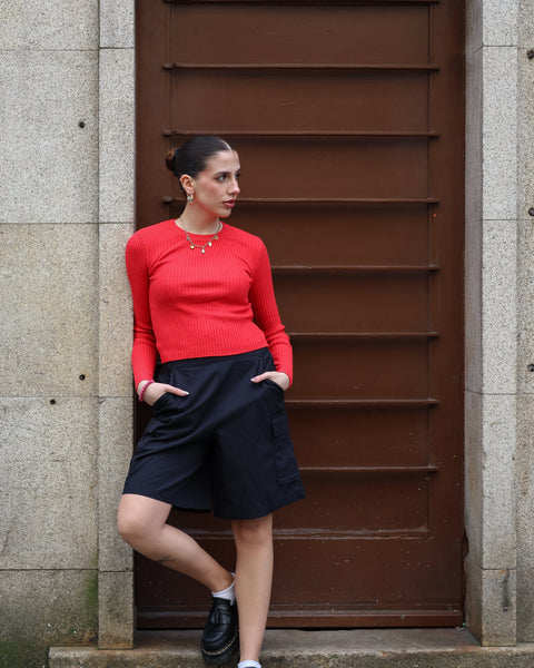 Chic long sleeve red cropped sweater featuring soft ribbed texture and modern elevated casual wear.