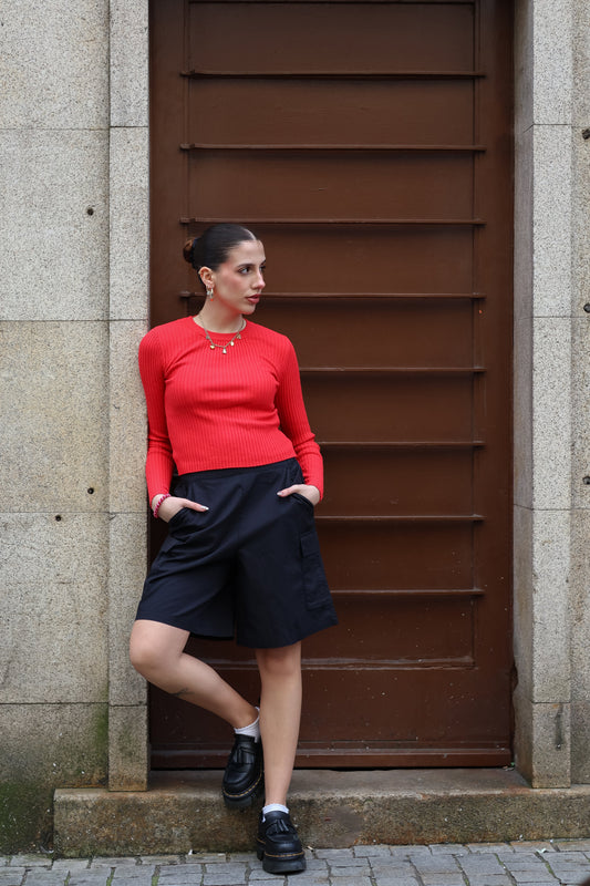 Chic long sleeve red cropped sweater featuring soft ribbed texture and modern elevated casual wear.
