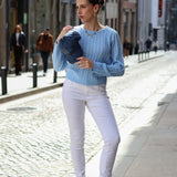 Lightweight cable knit sweater in pastel blue with sophisticated relaxed silhouette and luxe comfort.