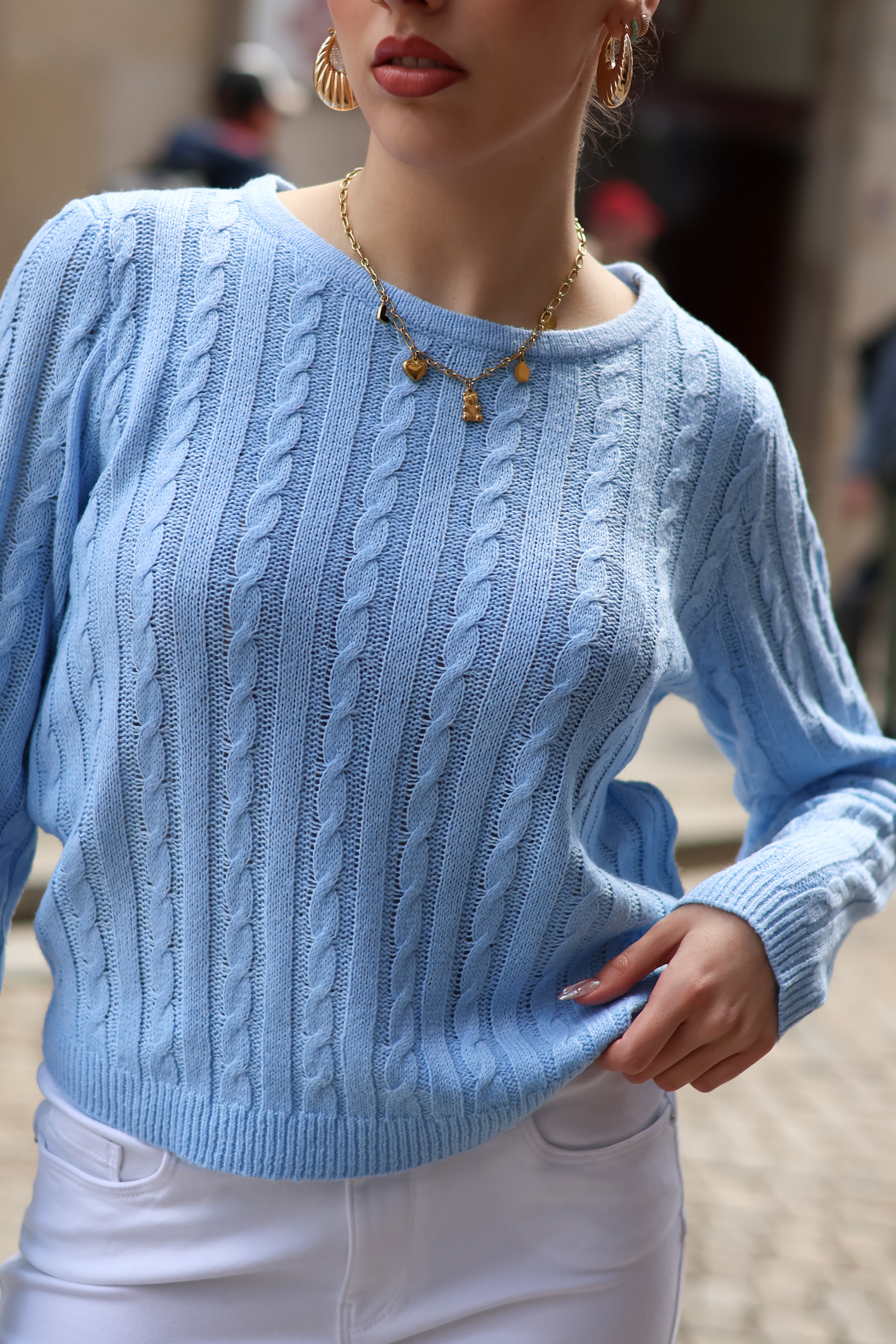 Cozy oversized cable knit sweater in soft sky blue with timeless preppy fashion aesthetic.