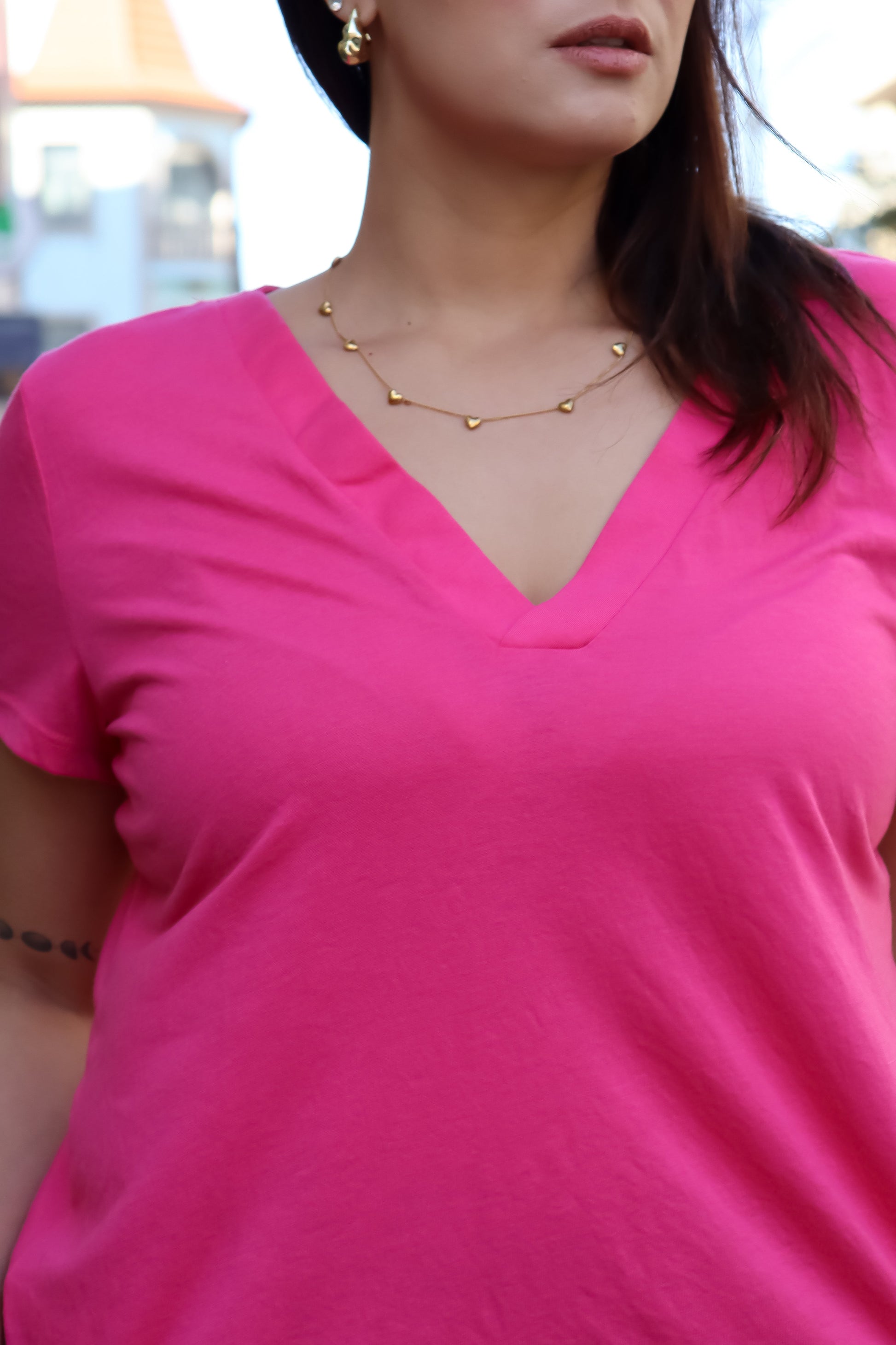 Casual-chic women’s pink t-shirt with flattering neckline and soft draped silhouette for everyday styling.
