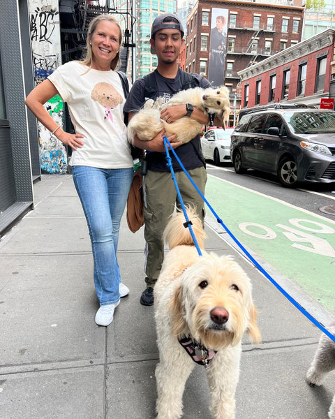 Women’s cute puppy graphic T-shirt in white with rolled sleeves for dog lovers and playful everyday fashion.