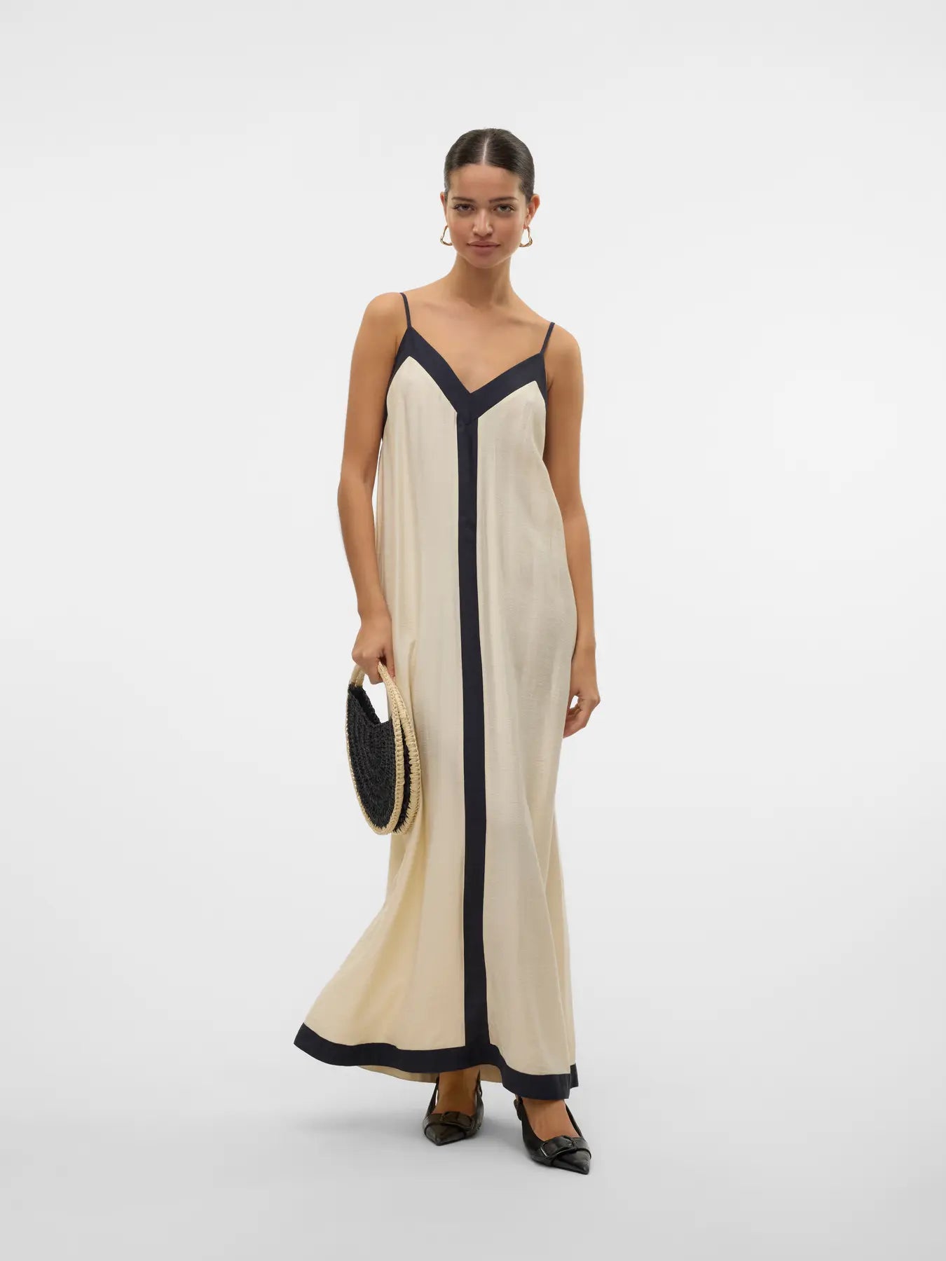 Chic flowy resort dress with contrast trim and elevated European-inspired boutique styling.