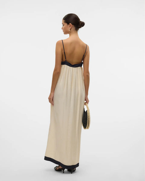 Elegant back view of women’s minimalist resortwear maxi dress with elegant contrast borders and timeless silhouette.