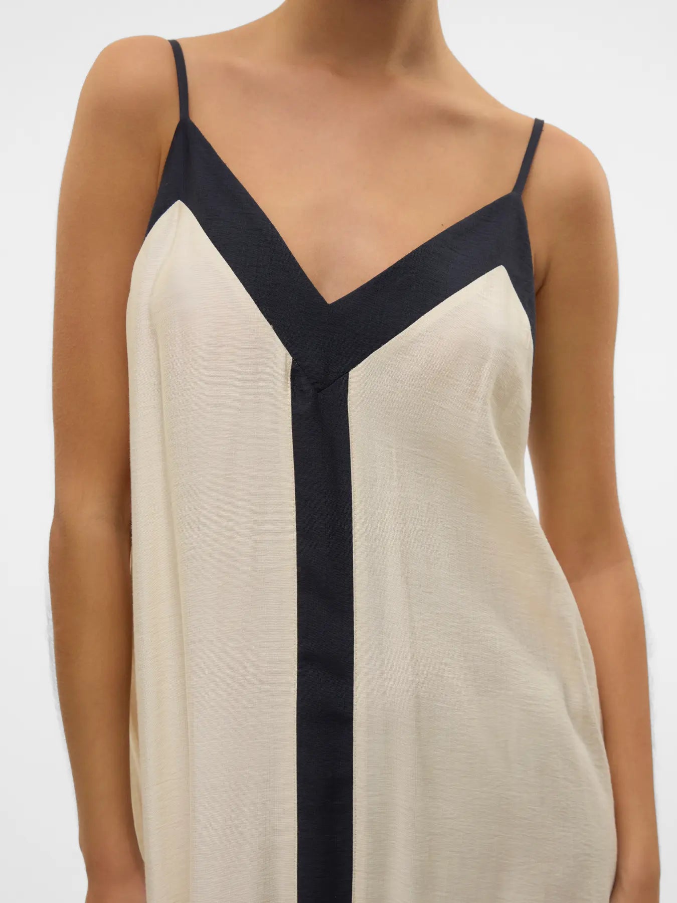 Boutique-style spaghetti strap maxi dress with contemporary monochrome design and relaxed sophistication.
