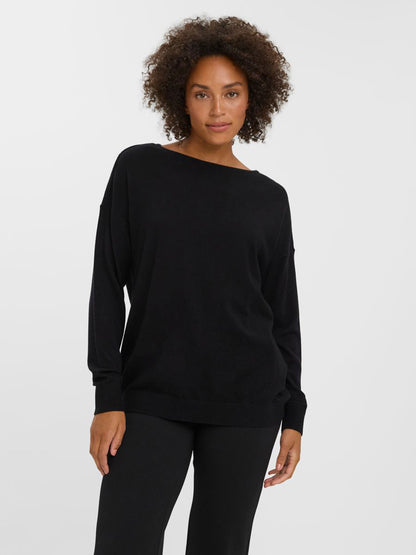 Relaxed fit black knit sweater perfect for layering with jeans, trousers, and skirts.