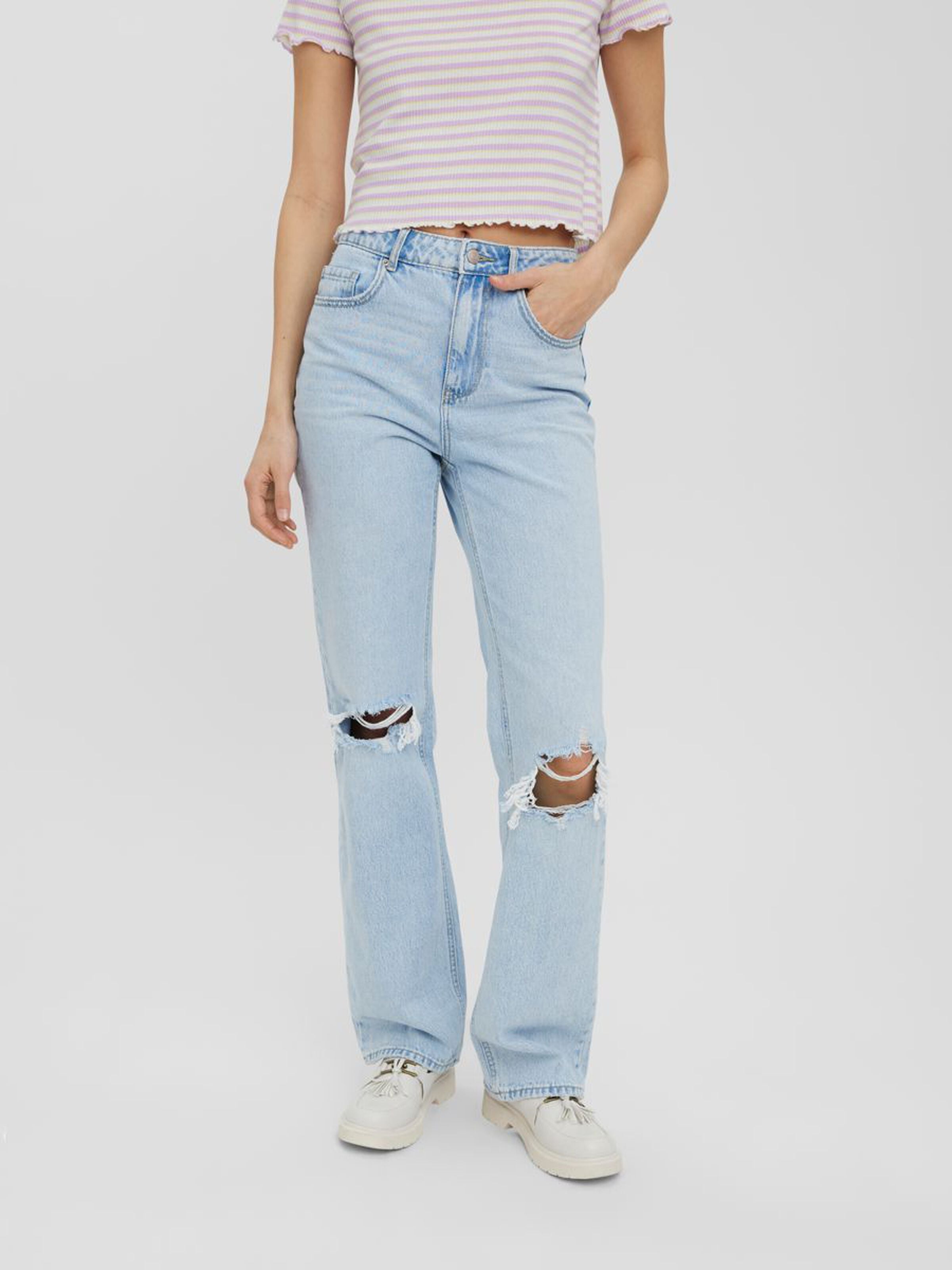 Women's relaxed fit denim jeans featuring a faded wash and modern distressed accents.