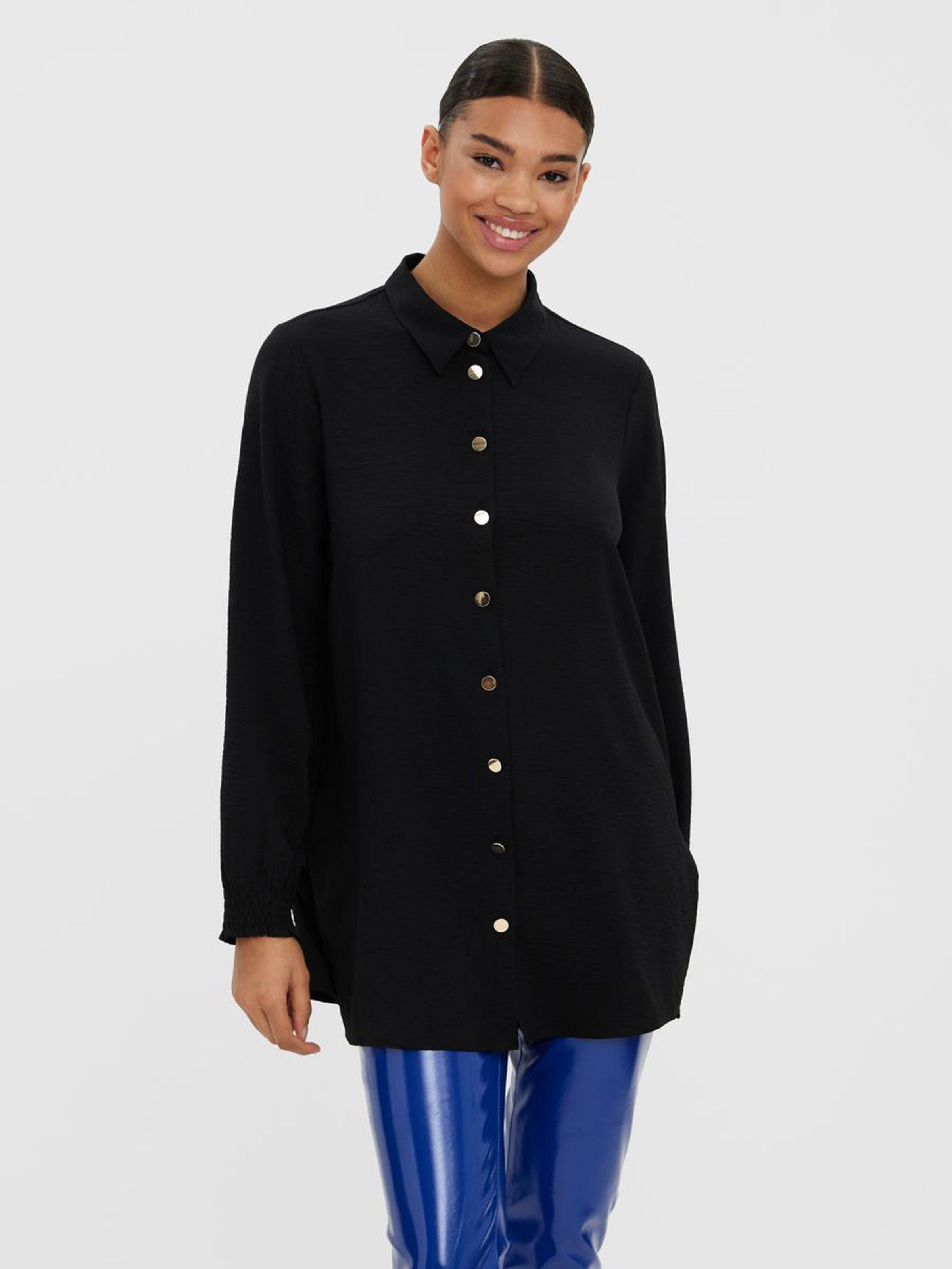Women's black longline button-front shirt featuring a relaxed silhouette and polished gold-tone buttons.