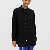 Women's black longline button-front shirt featuring a relaxed silhouette and polished gold-tone buttons.