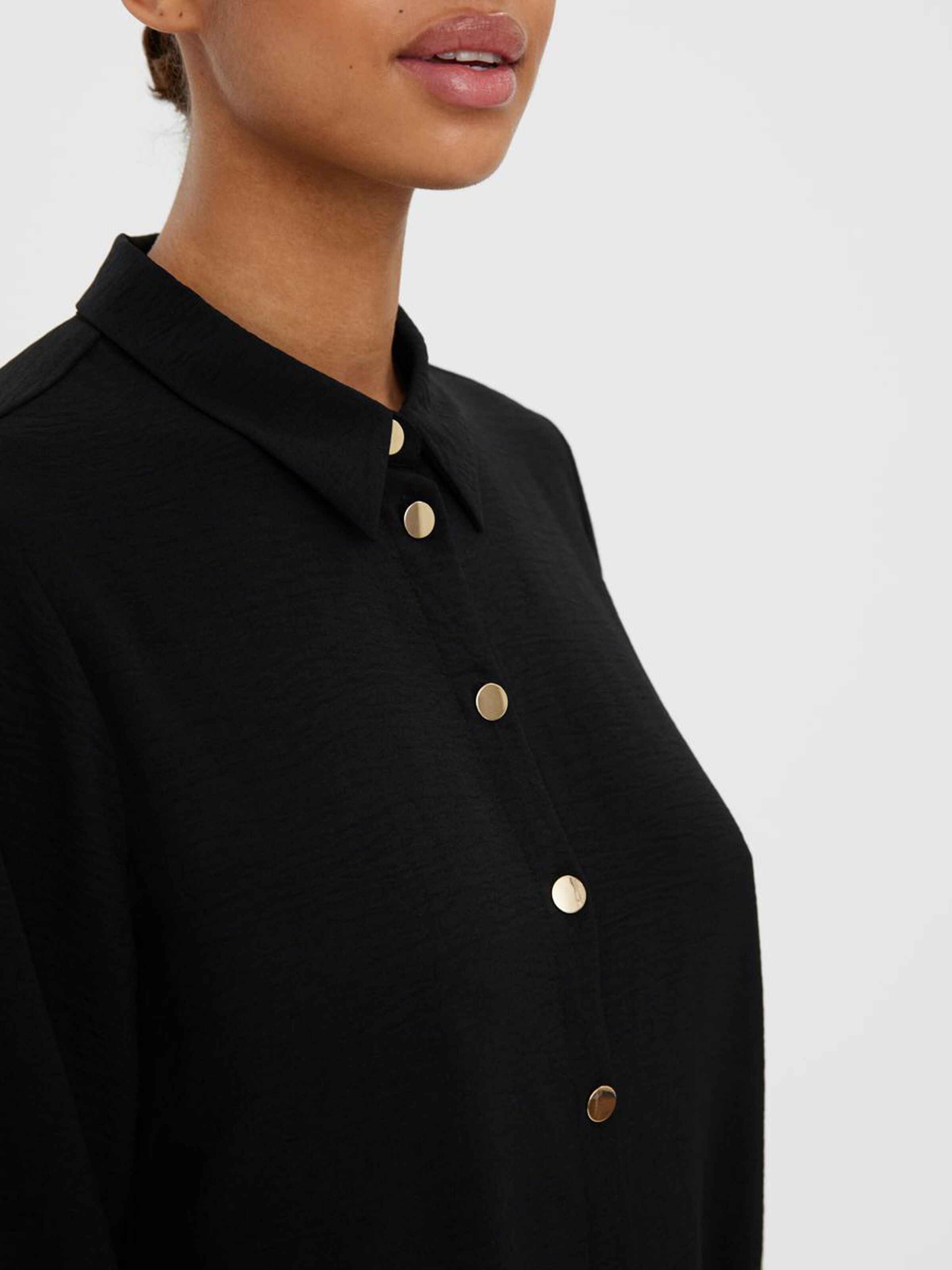 Black button-up blouse offering effortless elegance for office outfits and everyday fashion.