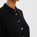 Black button-up blouse offering effortless elegance for office outfits and everyday fashion.