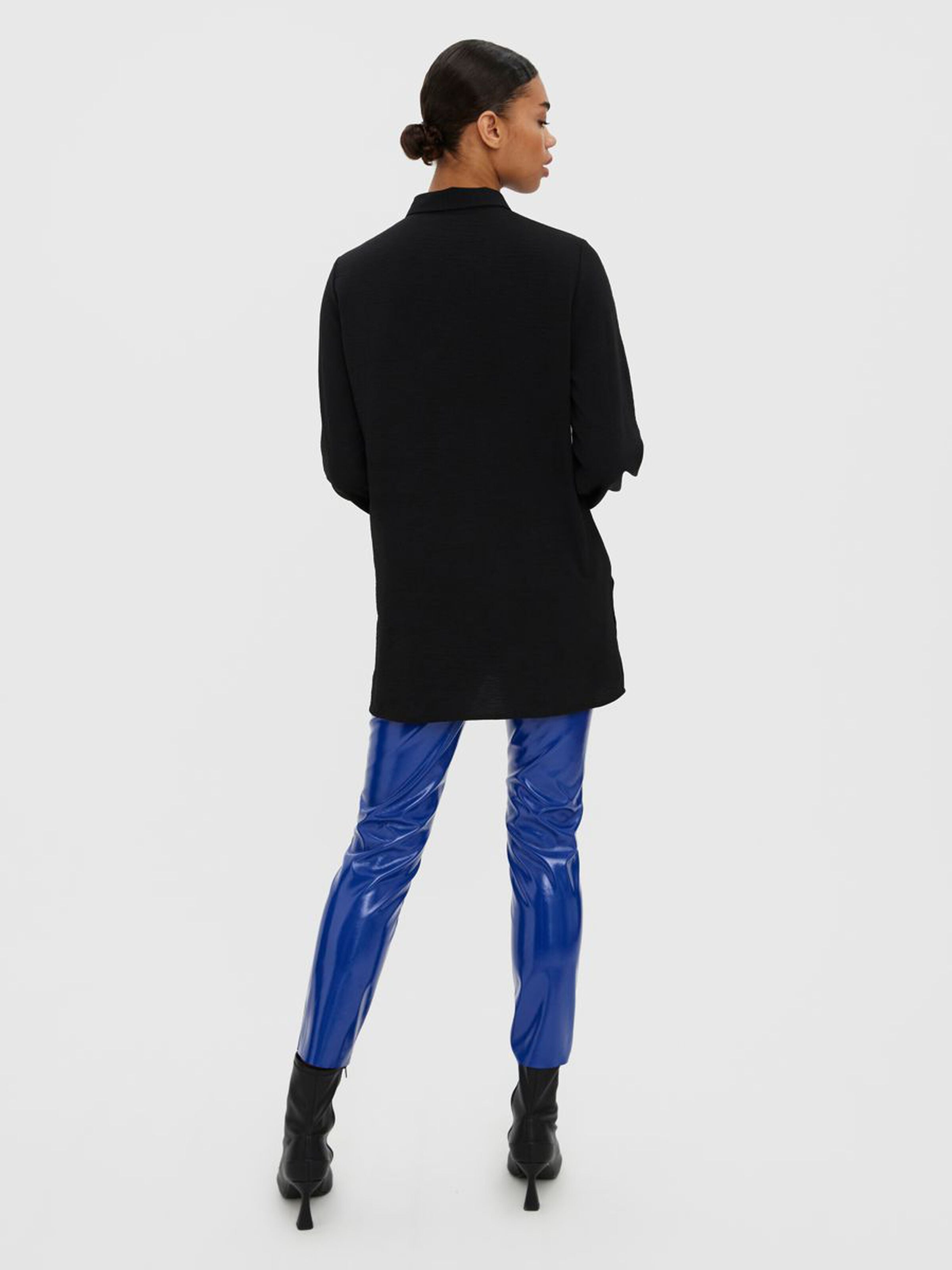 Chic black oversized shirt designed for effortless styling with jeans, leggings, or tailored pants.