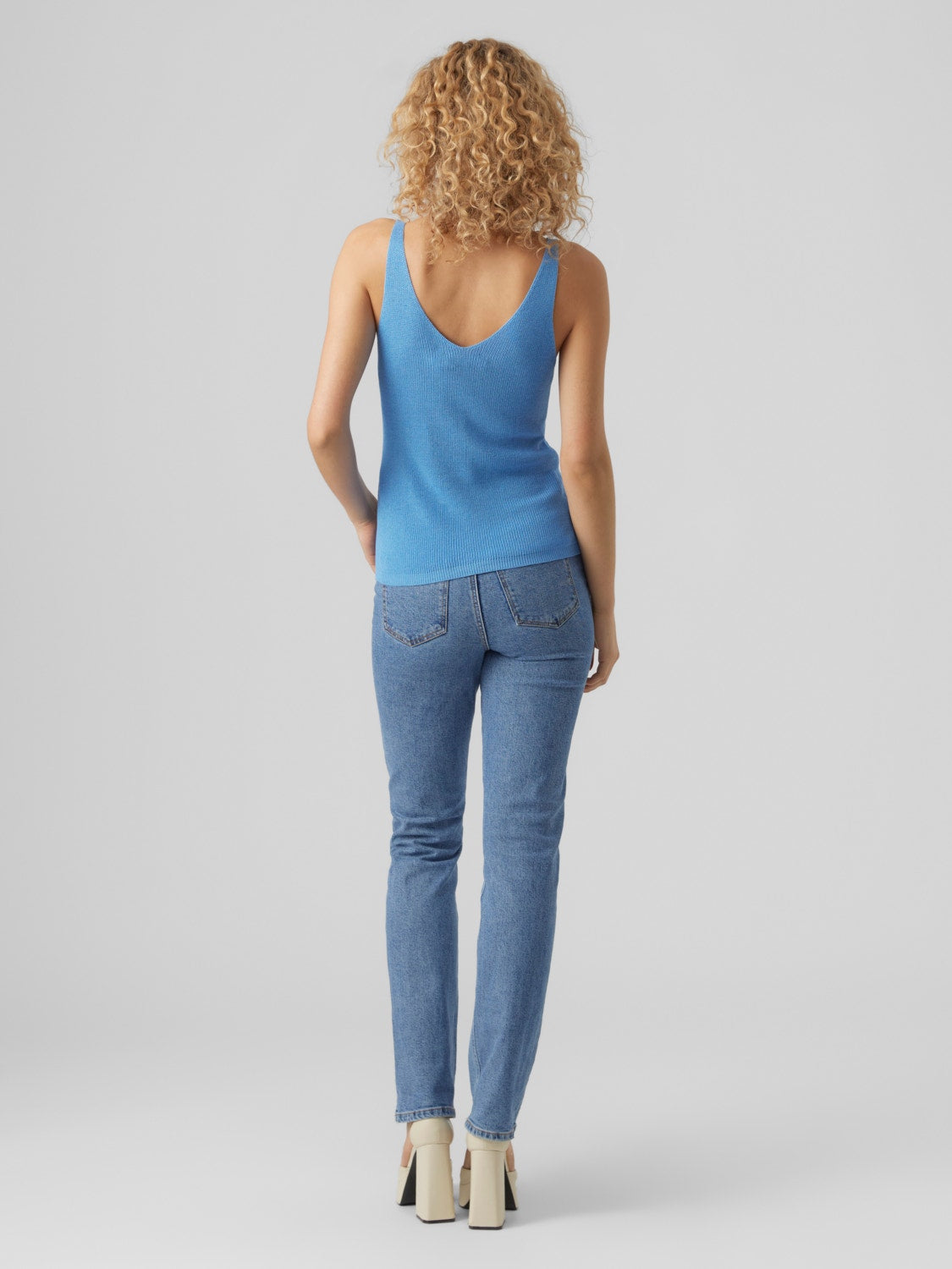 Women's essential blue tank top crafted from soft stretch knit fabric.