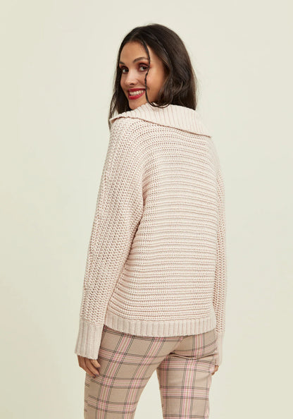Women's cozy cream sweater featuring a modern collar and soft knitted construction.
