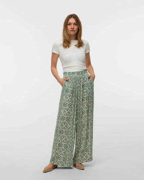 Lightweight boho palazzo pants featuring a soft all-over abstract pattern and relaxed flowing silhouette.
