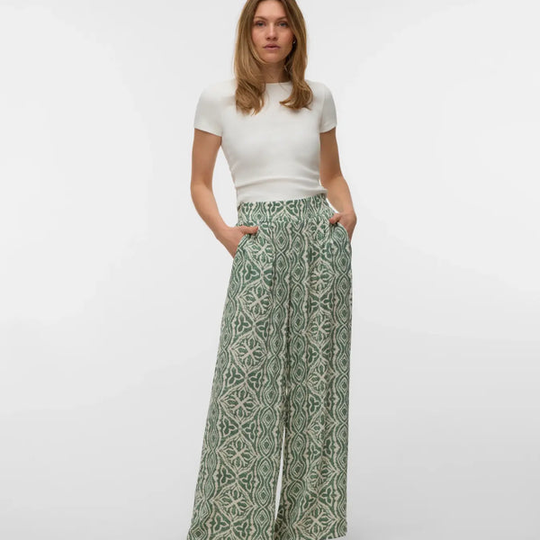 Lightweight boho palazzo pants featuring a soft all-over abstract pattern and relaxed flowing silhouette.